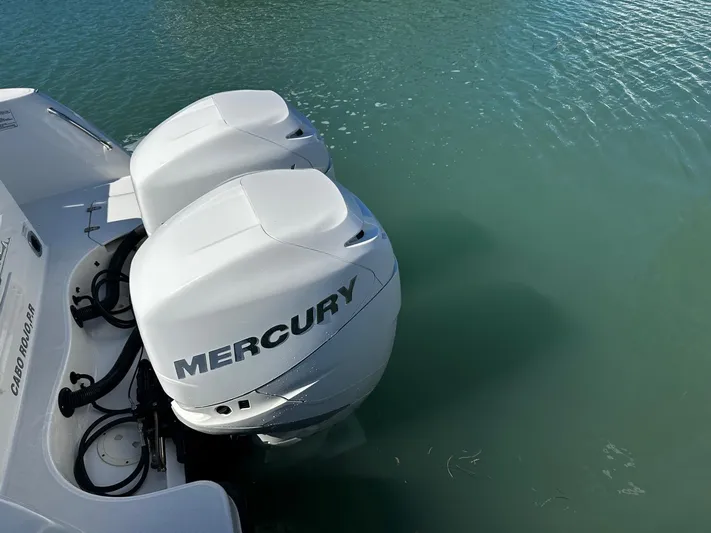  Yacht Photos Pics Twin Mercury outboard engines on a 2015 Boston Whaler 315 Conquest in water.