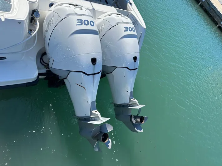  Yacht Photos Pics Twin 300 horsepower engines on a 2015 Boston Whaler 315 Conquest in clear water.