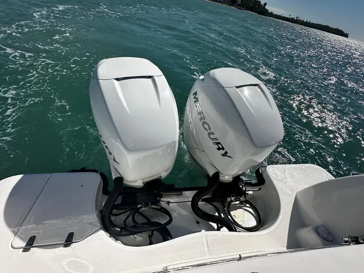  Yacht Photos Pics Twin Mercury outboard engines on a 2015 Boston Whaler 315 Conquest in open water.