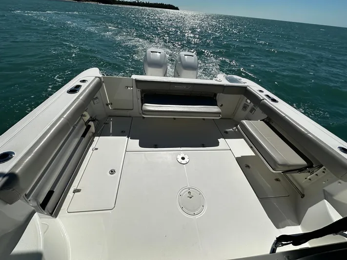  Yacht Photos Pics 2015 Boston Whaler 315 Conquest boat deck on open water.
