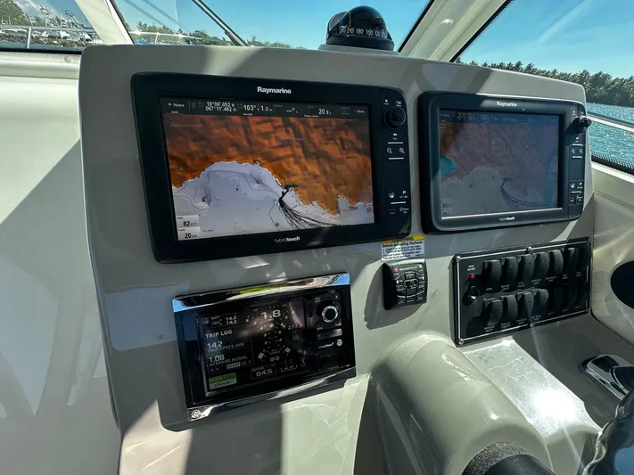  Yacht Photos Pics Control panel of 2015 Boston Whaler 315 Conquest with navigation screens.