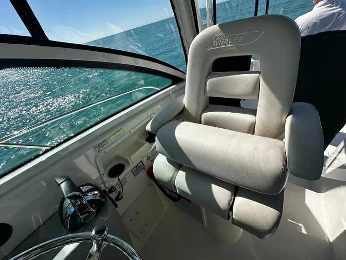 Yacht Photos Pics Captain's chair on 2015 Boston Whaler 315 Conquest, overlooking ocean view.