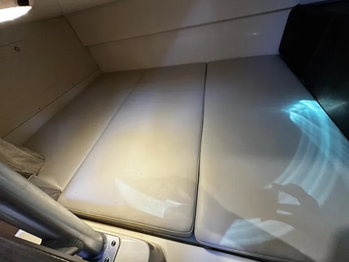  Yacht Photos Pics Interior cabin of 2015 Boston Whaler 315 Conquest, featuring cushioned seating.