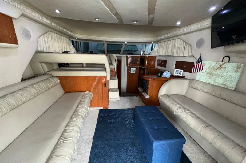  Yacht Photos Pics Interior of 2000 Sea Ray 400 Sedan Bridge yacht with plush seating and elegant decor.