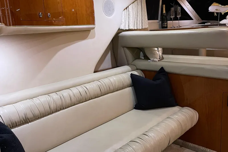  Yacht Photos Pics Luxurious interior of 2000 Sea Ray 400 Sedan Bridge yacht with elegant seating and decor.