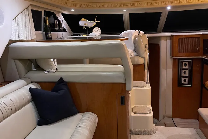  Yacht Photos Pics Luxurious interior of 2000 Sea Ray 400 Sedan Bridge yacht with elegant seating and decor.