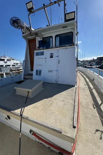 Daiwa Pacific Yacht Photos Pics 1966 Seaway Commercial Sportfish Vessel docked, featuring spacious deck and cabin, ideal for fishing.