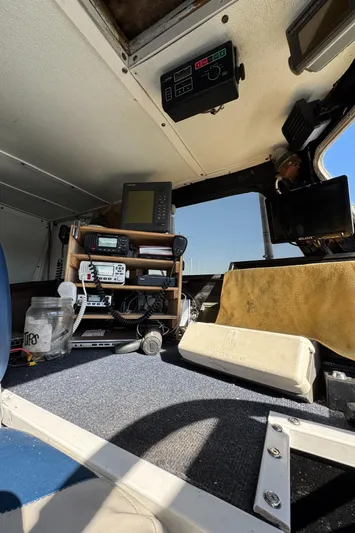 Daiwa Pacific Yacht Photos Pics Interior of 1966 Seaway Commercial Sportfish Vessel cockpit with navigation equipment.