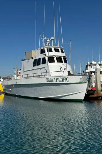 Daiwa Pacific Yacht Photos Pics Seaway 1966 commercial sportfish vessel docked, clear sky, marina background.