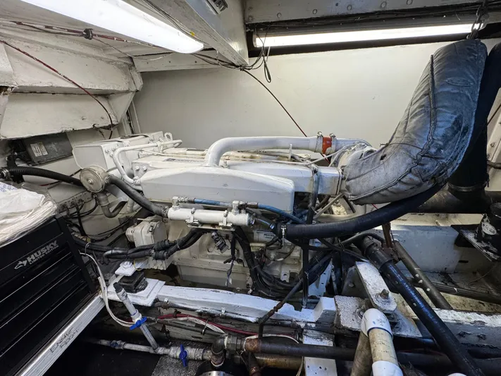 Daiwa Pacific Yacht Photos Pics Engine room of a 1966 Seaway Commercial Sportfish Vessel, showcasing mechanical components and piping.