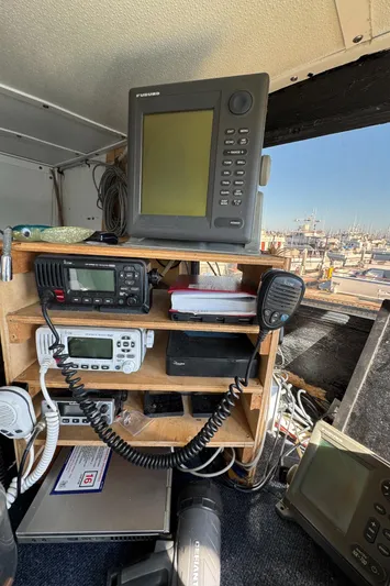 Daiwa Pacific Yacht Photos Pics Control panel of a 1966 Seaway Commercial Sportfish Vessel with navigation equipment.