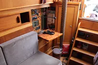 Interior of 1987 Zeeschouw Liamer boat with wooden paneling and navigation equipment.