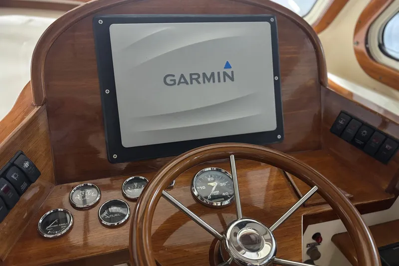 Pirouette Yacht Photos Pics Hinckley 36 Picnic Boat EP 2003 dashboard with Garmin navigation system and gauges.