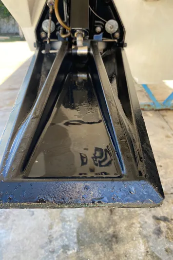 Wheeler Dealer Yacht Photos Pics Close-up of a 2006 Fountain 42 Executioner boat component, showcasing sleek black metalwork.