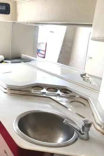 Wheeler Dealer Yacht Photos Pics 2006 Fountain 42 Executioner boat interior with sink and countertop.