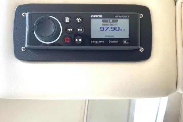 Wheeler Dealer Yacht Photos Pics Fusion marine stereo system on a 2006 Fountain 42 Executioner boat dashboard.