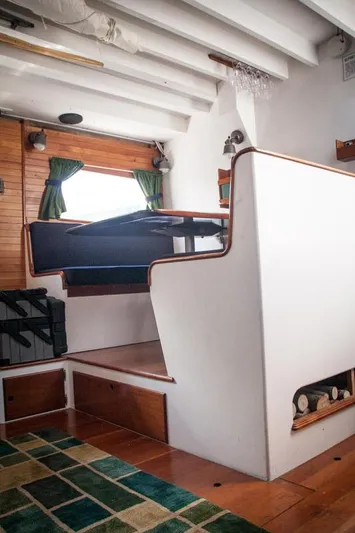 Miss Nina Yacht Photos Pics Interior of 1996 Custom Bolger PH Shoal-draft Ketch with wooden accents and nautical decor.