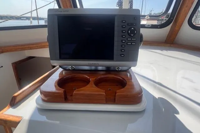 Miss Nina Yacht Photos Pics Cockpit of 1996 Custom Bolger PH Shoal-draft Ketch with navigation system and cup holders.