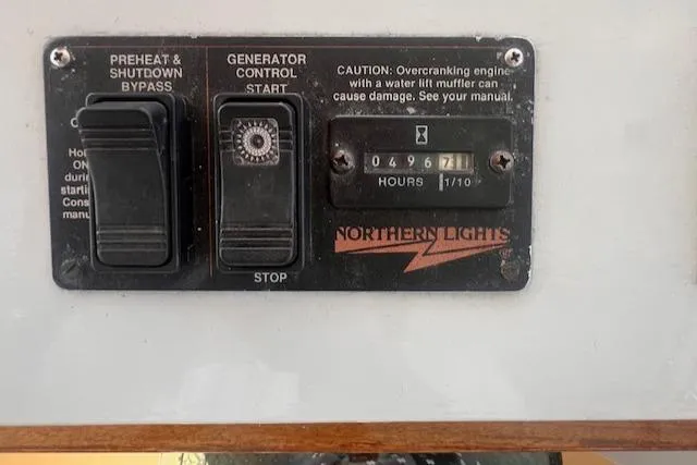 Miss Nina Yacht Photos Pics Control panel of a 1996 Custom Bolger PH Shoal-draft Ketch with generator hour meter.