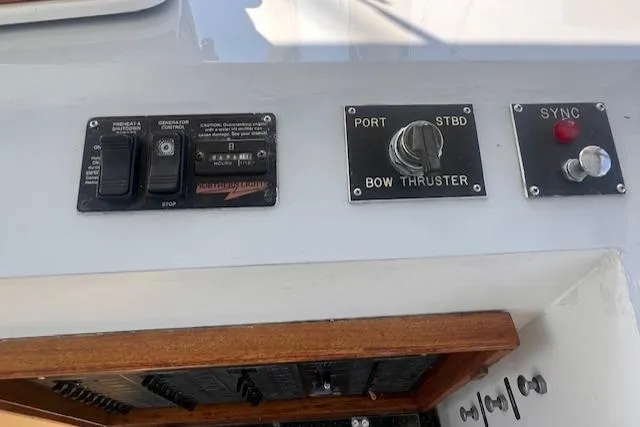 Miss Nina Yacht Photos Pics Control panel of a 1996 Custom Bolger PH Shoal-draft Ketch with bow thruster and sync switch.