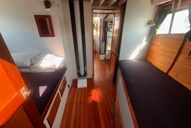 Miss Nina Yacht Photos Pics Interior of 1996 Custom Bolger PH Shoal-draft Ketch with wooden flooring and cozy berths.