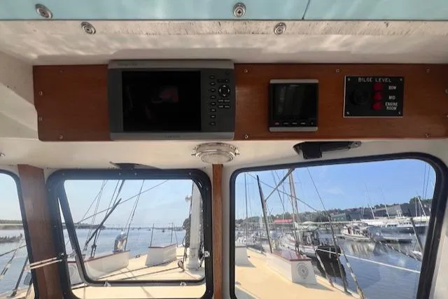 Miss Nina Yacht Photos Pics Interior view of 1996 Custom Bolger PH Shoal-draft Ketch, showing navigation equipment and marina.