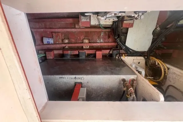 Miss Nina Yacht Photos Pics Engine compartment of a 1996 Custom Bolger PH Shoal-draft Ketch with visible wiring and components.