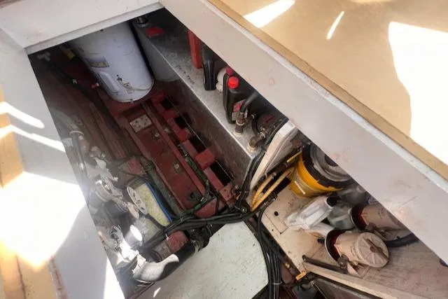 Miss Nina Yacht Photos Pics Engine compartment of 1996 Custom Bolger PH Shoal-draft Ketch, showing mechanical components and wiring.