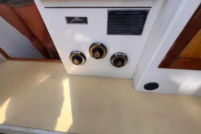 Miss Nina Yacht Photos Pics Control panel of a 1996 Custom Bolger PH Shoal-draft Ketch with labeled dials and instructions.