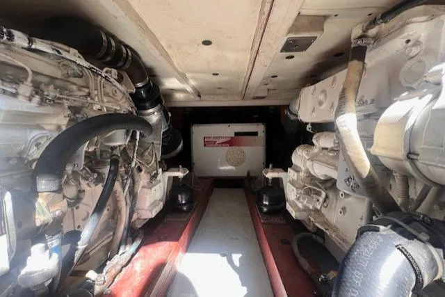 Miss Nina Yacht Photos Pics Engine room of 1996 Custom Bolger PH Shoal-draft Ketch with visible machinery components.