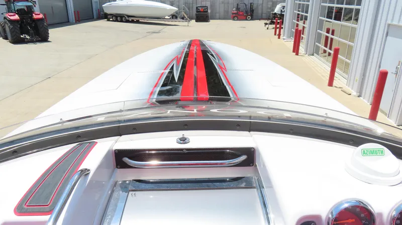  Yacht Photos Pics 2009 Donzi 35ZR boat with sleek red and black design, parked in a marina.