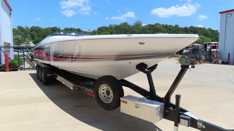 Yacht Photos Pics 2009 Donzi 35ZR speedboat on trailer, parked outdoors under clear blue sky.
