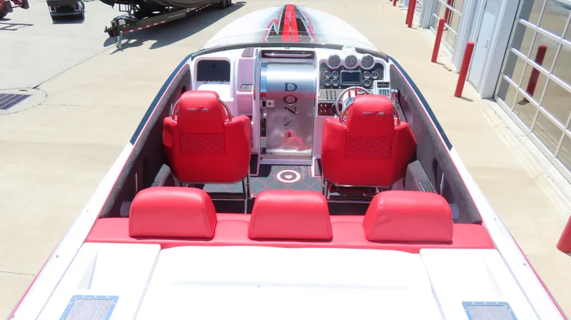  Yacht Photos Pics 2009 Donzi 35ZR boat interior with red seats and modern dashboard.