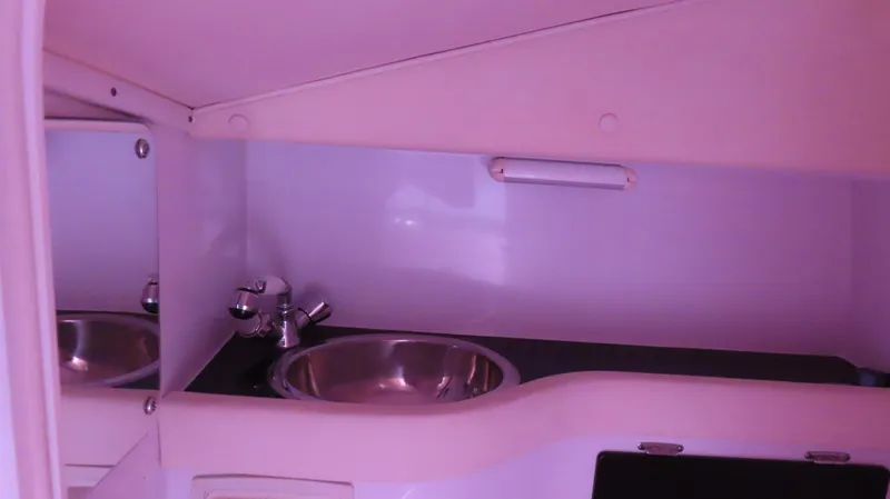  Yacht Photos Pics 2009 Donzi 35ZR boat interior with sink and mirror in cabin.
