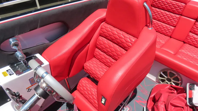  Yacht Photos Pics Red leather interior of 2009 Donzi 35ZR boat with quilted seats and steering wheel.
