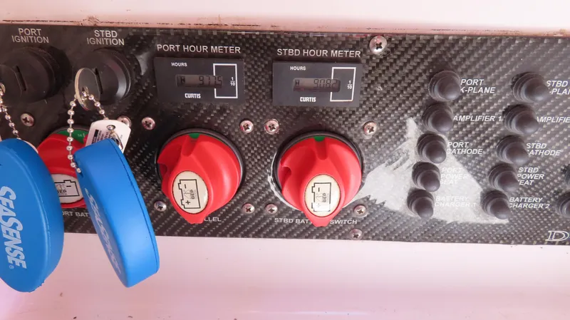  Yacht Photos Pics Control panel of a 2009 Donzi 35ZR boat with switches and hour meters.