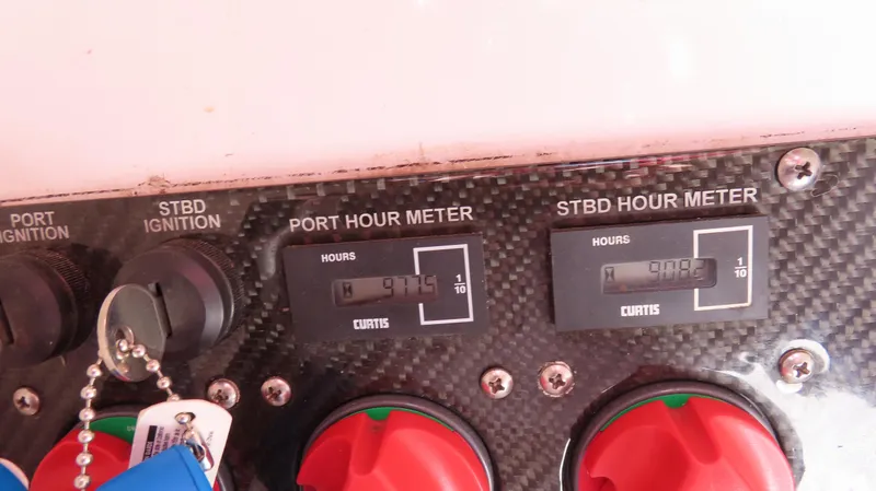  Yacht Photos Pics Dashboard of a 2009 Donzi 35ZR showing port and starboard hour meters.