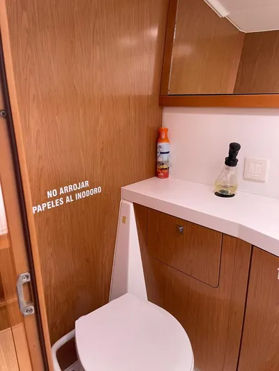 La Vieja Yacht Photos Pics Bathroom in 2011 Beneteau Sense 50 yacht with wooden cabinetry and toilet.