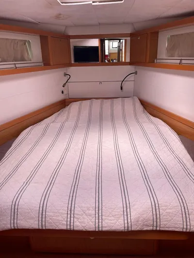 La Vieja Yacht Photos Pics Interior cabin of 2011 Beneteau Sense 50 yacht with a neatly made bed.