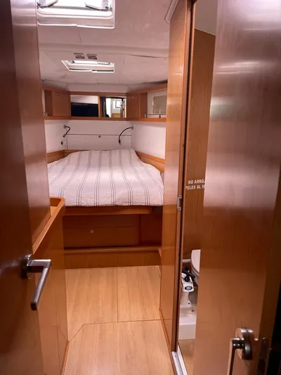 La Vieja Yacht Photos Pics 2011 Beneteau Sense 50 yacht interior with cozy bedroom and wooden finish.
