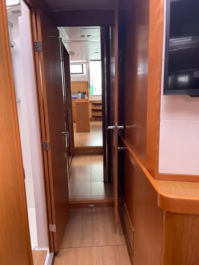 La Vieja Yacht Photos Pics Interior view of 2011 Beneteau Sense 50 yacht, featuring wooden cabinetry and modern design.