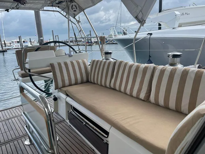 La Vieja Yacht Photos Pics Beneteau Sense 50 yacht cockpit with striped cushions, docked at marina, 2011 model.