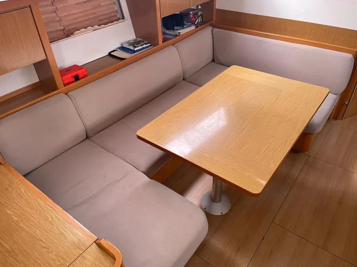 La Vieja Yacht Photos Pics Interior of 2011 Beneteau Sense 50 yacht with cozy seating and wooden table.