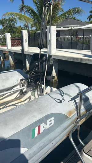 La Vieja Yacht Photos Pics Inflatable boat docked near Beneteau Sense 50, 2011 model, with palm trees in the background.