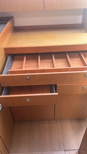 La Vieja Yacht Photos Pics Wooden cabinetry with open drawers in a 2011 Beneteau Sense 50 yacht interior.