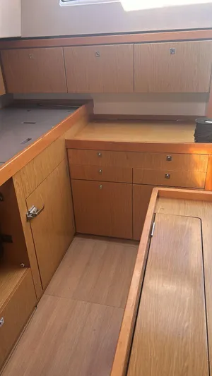 La Vieja Yacht Photos Pics Interior of 2011 Beneteau Sense 50 yacht, featuring wooden cabinetry and modern design.