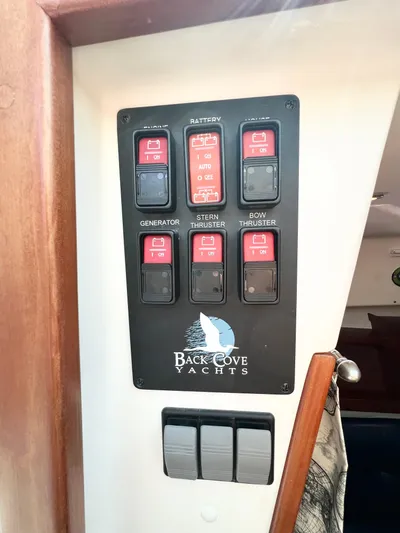 Traveller Yacht Photos Pics Control panel of a 2016 Back Cove 34 yacht with labeled switches.
