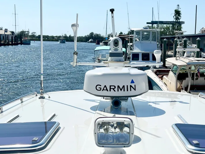 Traveller Yacht Photos Pics 2016 Back Cove 34 boat with Garmin equipment docked in a marina.