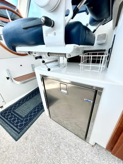 Traveller Yacht Photos Pics 2016 Back Cove 34 interior with blue seating and stainless steel storage.