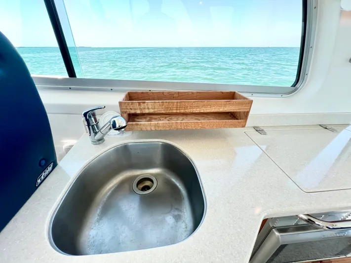 Traveller Yacht Photos Pics Back Cove 34 (2016) yacht kitchen sink with ocean view through window.